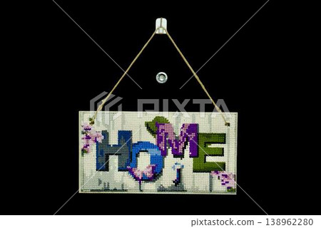 Decorative wooden sign with "HOME" text isolated on transparent background. Cozy wall decor with rope hanger, interior design element. Decorative wooden sign with "HOME" text isolated on transparent background. Cozy wall decor with rope hanger, interior design element. 138962280