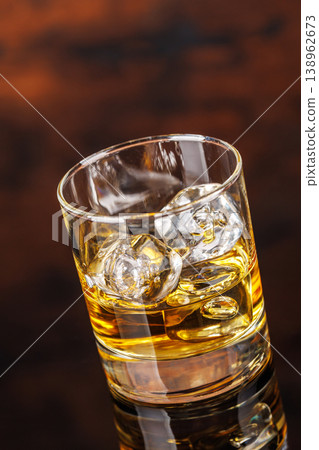 Glass of whiskey with ice 138962673