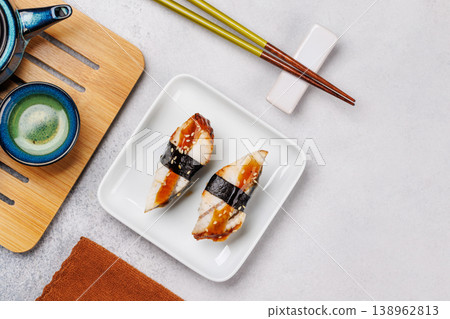 Eel sushi set with tea and teapot Eel sushi set with tea and teapot 138962813