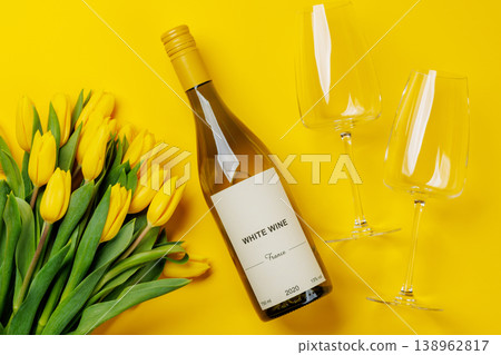 White wine bottle with yellow tulips White wine bottle with yellow tulips 138962817