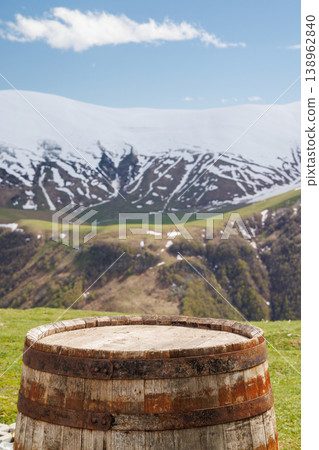 Wooden barrel with mountains in background 138962840