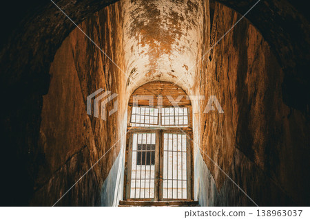 Stone walls and a staircase of light 138963037