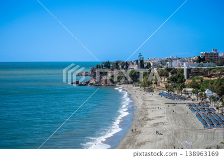 Wonderful landscapes of the shimmering sea and charming city unfold, offering breathtaking coastal views and a picturesque atmosphere in Nerja, Spain Wonderful landscapes of the shimmering sea and charming city unfold, offering breathtaking coastal views and a picturesque atmosphere in Nerja, Spain 138963169