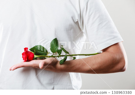 Man with single red rose Man with single red rose 138963380