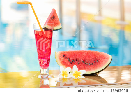 Summer holiday tropical concept. Fresh watermelon juice and watermelon on border of a swimming pool. 138963636