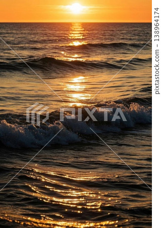 Golden waves under the setting sun; golden shimmer on the sea surface 138964174