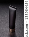 Black empty plastic tube for cream, paste, or shampoo as a mockup. An empty cosmetic tube mockup 138964484