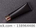 Black empty plastic tube for cream, paste, or shampoo as a mockup. An empty cosmetic tube mockup 138964486