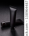 Black empty plastic tube for cream, paste, or shampoo as a mockup. An empty cosmetic tube mockup 138964487