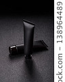 Black empty plastic tube for cream, paste, or shampoo as a mockup. An empty cosmetic tube mockup 138964489