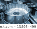 Wire-cut electrical discharge machine. Operation of wire-EDM machine cutting metal parts. Electrical discharge machine EDM cutting metal workpiece. Cutting process by wire cut machine. Metalworking 138964499