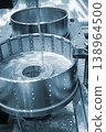 Wire-cut electrical discharge machine. Operation of wire-EDM machine cutting metal parts. Electrical discharge machine EDM cutting metal workpiece. Cutting process by wire cut machine. Metalworking 138964500