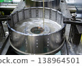 Wire-cut electrical discharge machine. Operation of wire-EDM machine cutting metal parts. Electrical discharge machine EDM cutting metal workpiece. Cutting process by wire cut machine. Metalworking 138964501