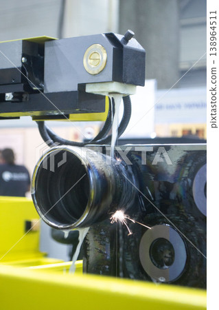 Wire-cut electrical discharge machine. Operation of wire-EDM machine cutting metal parts. Electrical discharge machine EDM cutting metal workpiece. Cutting process by wire cut machine. Metalworking 138964511
