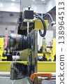 Wire-cut electrical discharge machine. Operation of wire-EDM machine cutting metal parts. Electrical discharge machine EDM cutting metal workpiece. Cutting process by wire cut machine. Metalworking 138964513