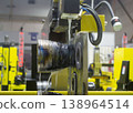 Wire-cut electrical discharge machine. Operation of wire-EDM machine cutting metal parts. Electrical discharge machine EDM cutting metal workpiece. Cutting process by wire cut machine. Metalworking 138964514