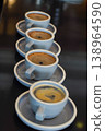 Row of espresso cups with crema and shallow focus, ideal for cafe, beverage, and coffee lifestyle themes 138964590