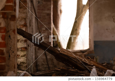 Abandoned Brick Wall and Wooden Debris with Trees Visible Through Broken Window in Rustic Style Abandoned Brick Wall and Wooden Debris with Trees Visible Through Broken Window in Rustic Style 138964779