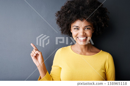 Black woman, pointing and happy portrait in studio, mockup and gray background with announcement information. Hand, sign or face of person with opinion, advice or positive choice and gesture to promo 138965118