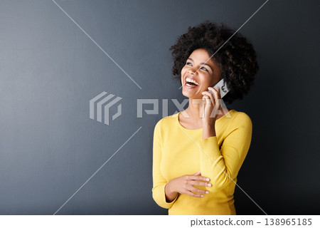 Black woman, laughing and happy phone call, communication or connection in studio background. African, face or person in funny mobile conversation with joke or listening to contact talking with humor Black woman, laughing and happy phone call, communication or connection in studio background. African, face or person in funny mobile conversation with joke or listening to contact talking with humor 138965185