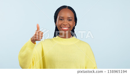 Portrait, opportunity and black woman with thumbs up, support and decision on a blue studio background. Face, African person and model with hand gesture, sign and feedback with review and emoji Portrait, opportunity and black woman with thumbs up, support and decision on a blue studio background. Face, African person and model with hand gesture, sign and feedback with review and emoji 138965194