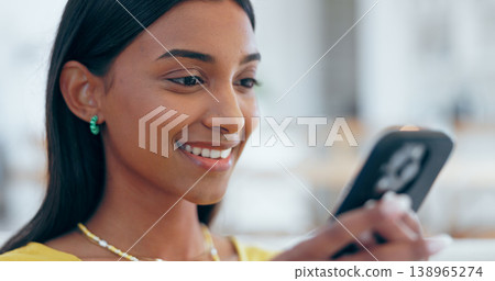 Happy, Indian woman and reading with phone for social media in home with funny meme, post or blog online. Internet, search and communication with cellphone to chat, contact or network with a smile Happy, Indian woman and reading with phone for social media in home with funny meme, post or blog online. Internet, search and communication with cellphone to chat, contact or network with a smile 138965274