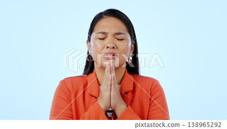 Hope, religion and woman with faith, praying and gratitude on a blue studio background. Person, girl and model with gesture, prayer and spirit with guidance, Christian and emoji with stress and peace 138965292