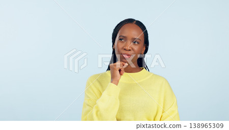 Woman, ideas and thinking in studio while planning choice, future inspiration and mockup space on blue background. African model daydream of decision, remember memory or solution of questions in mind 138965309