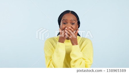 Covering mouth, wow and portrait of a black woman with a secret, gossip or rumor on a blue background. Shock, happiness and excited African girl with expression of surprise, amazed and good news 138965389