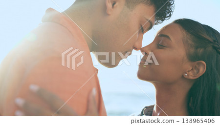 Couple, hug and beach date on holiday with love, support and travel with marriage and vacation. Summer, adventure and calm outdoor with a woman and man together by the ocean with touch and embrace Couple, hug and beach date on holiday with love, support and travel with marriage and vacation. Summer, adventure and calm outdoor with a woman and man together by the ocean with touch and embrace 138965406
