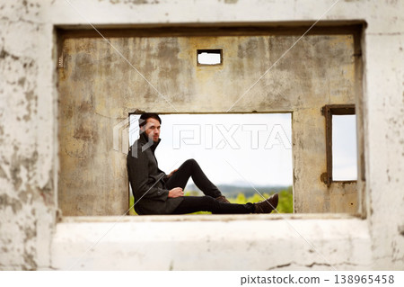 Man, frame and travel by ruin house, relax and chilling by remains of building, smile and portrait. Happy male person, historic site and vacation for culture, history and tourism in Machu Picchu 138965458