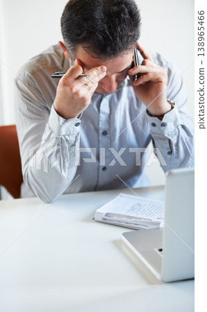 Phone call, stress or businessman with audit in company on mobile conversation as communication. Laptop, crisis or frustrated manager in discussion, talking or speaking of debt or paperwork in office 138965466