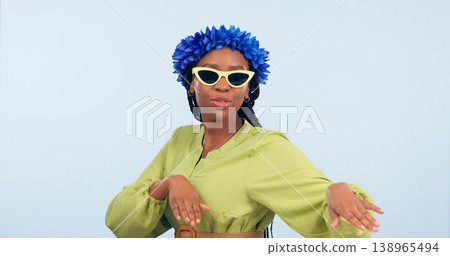 Woman, dance and fashion for vacation in studio for mockup for offer blue background. African person, happy and sunglasses in portrait for flowers on head for tropical holiday, trip or travel for fun Woman, dance and fashion for vacation in studio for mockup for offer blue background. African person, happy and sunglasses in portrait for flowers on head for tropical holiday, trip or travel for fun 138965494