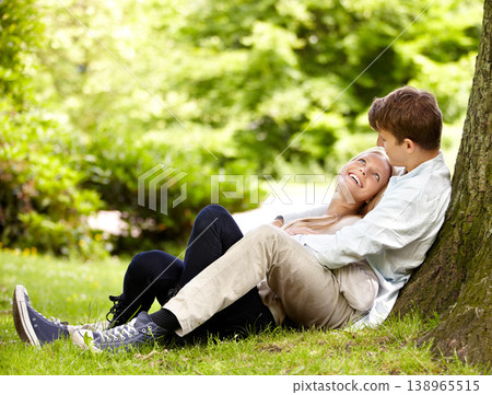 Park, relax and happy couple hug, love and cuddle in outdoor nature, green garden or grass field, pitch or lawn. Eye contact, wellness and romantic man, woman or marriage people embrace on ground Park, relax and happy couple hug, love and cuddle in outdoor nature, green garden or grass field, pitch or lawn. Eye contact, wellness and romantic man, woman or marriage people embrace on ground 138965515