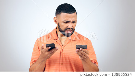 Man in studio with phone, credit card and frustrated with connection problem, debt or glitch. Fintech, anger or confused person with smartphone for banking, online shopping or 404 on white background Man in studio with phone, credit card and frustrated with connection problem, debt or glitch. Fintech, anger or confused person with smartphone for banking, online shopping or 404 on white background 138965524