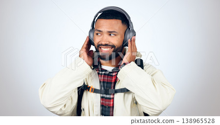Man, travel and listening with headphones for music in studio, background or streaming audio. Radio, podcast and person hiking and relax with hip hop or download sound online to hear with technology 138965528