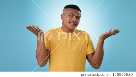 Confused, shrug and man portrait in studio with why hands on blue background space. Doubt, face and model with dont know emoji for choice, decision or palm scale, questions or asking body language Confused, shrug and man portrait in studio with why hands on blue background space. Doubt, face and model with dont know emoji for choice, decision or palm scale, questions or asking body language 138965620