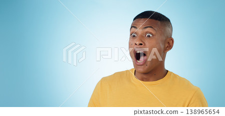 Wow, surprise and shocked man in studio with news, information or promotion on blue background. Omg, emoji and face of male model with unexpected announcement, gossip or confused by secret giveaway Wow, surprise and shocked man in studio with news, information or promotion on blue background. Omg, emoji and face of male model with unexpected announcement, gossip or confused by secret giveaway 138965654