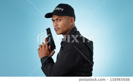 Man, security guard and holding gun for shooting, protection and hands with face, portrait or confident. Safety, service or weapon for criminal, law or studio background for pistol, crime or eyes Man, security guard and holding gun for shooting, protection and hands with face, portrait or confident. Safety, service or weapon for criminal, law or studio background for pistol, crime or eyes 138965686