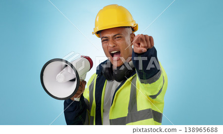 Construction worker, builder or angry man with megaphone in studio for renovation or development. Speaking, pointing or male engineer shouting in building project or communication on blue background Construction worker, builder or angry man with megaphone in studio for renovation or development. Speaking, pointing or male engineer shouting in building project or communication on blue background 138965688
