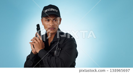 Man, security guard and holding gun for shooting, protection and precaution for job, serious or confident. Target, killing or weapon for criminal, safety or studio background for pistol, crime or law 138965697