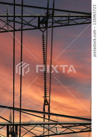 High Voltage Power Transmission Tower at Dusk High Voltage Power Transmission Tower at Dusk 138965723