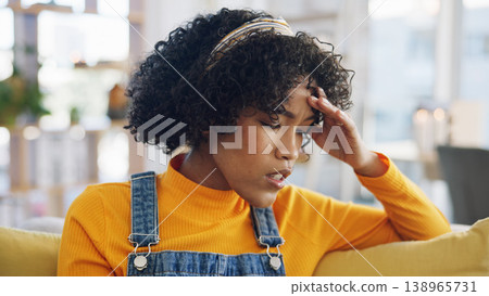 Young woman, headache and thinking on sofa, stress and anxiety for choice, memory or regret in home living room. Gen z girl, student and mental health with fatigue, decision or worry on lounge couch Young woman, headache and thinking on sofa, stress and anxiety for choice, memory or regret in home living room. Gen z girl, student and mental health with fatigue, decision or worry on lounge couch 138965731