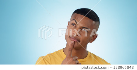 Man, face and thinking in planning, decision or choice for idea or memory against a blue studio background. Unsure male person or curious model in wonder, remember or solution in why, emoji or mockup Man, face and thinking in planning, decision or choice for idea or memory against a blue studio background. Unsure male person or curious model in wonder, remember or solution in why, emoji or mockup 138965848