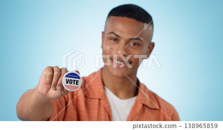 Man, vote sticker and smile for election, positive and politics for america, government and blue studio background. Badge, voter choice and support for party, registration or hand for voting register Man, vote sticker and smile for election, positive and politics for america, government and blue studio background. Badge, voter choice and support for party, registration or hand for voting register 138965859