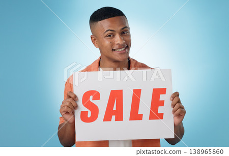 Portrait, man or poster with sale, promotion or discount deal with sign on blue background. Face, person or model with paper, information or presentation with announcement, saving or opportunity Portrait, man or poster with sale, promotion or discount deal with sign on blue background. Face, person or model with paper, information or presentation with announcement, saving or opportunity 138965860