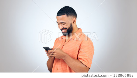 Phone, chat and happy man laugh in studio with online comic, meme or funny text on grey background. Smartphone, smile or male model with app joke, humor and contact or web, network or communication Phone, chat and happy man laugh in studio with online comic, meme or funny text on grey background. Smartphone, smile or male model with app joke, humor and contact or web, network or communication 138965992