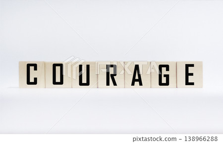 Courage is a word written on wooden blocks on a white background Courage is a word written on wooden blocks on a white background 138966288
