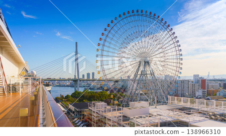 Osaka, Japan - Oct 11 2024, Panoramic aerial view of the Tempozan Ferris Wheel at the Osaka Port Cruise Terminal and the facade of the MSC Bellissima cruise ship, at daytime, Osaka, Japan 138966310