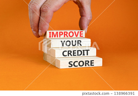 Improve your credit score words symbol. Concept words Improve your credit score on beautiful wooden blocks. Beautiful orange background. Business improve your credit score concept. Copy space. Improve your credit score words symbol. Concept words Improve your credit score on beautiful wooden blocks. Beautiful orange background. Business improve your credit score concept. Copy space. 138966391